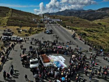 Families block road after bloody Guatemala village attack.jpg