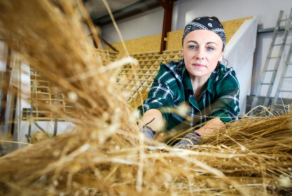 Trainee Fidelma Toland follows a course at the Donegal Thatching school in Portnoo, Donegal, north western Ireland which has opened in a bid to save the country's disappearing thatched roofs