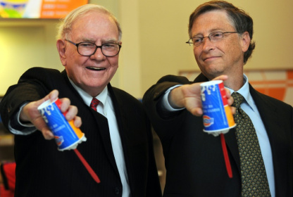 US billionaire investor Warren Buffett (L) and Microsoft founder Bill Gates (R) flip over their Dairy Queen Blizzard treats in Beijing in 2011; Dairy Queen is one of dozens of iconic brands owned by Buffett's Berkshire Hathaway - FREDERIC J. BROWN (AFP)