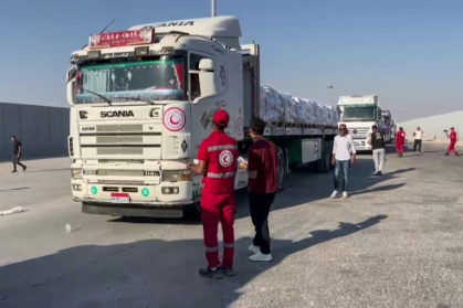 Aid trucks have begun crossing into Gaza from Egypy but aid agencies warn that without a permanent ceasefire a large-scale humanitarian operation will be impossible - AFPTV STRINGER (AFP)