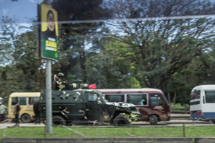 Soldiers in Zanzibar drive past posters of President Samia Suluhu Hassan - MARCO LONGARI (AFP)