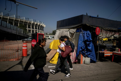 Food stalls in the shadow of the Azteca Stadium in Mexico City are under pressure to move before the World Cup - CARL DE SOUZA (AFP)