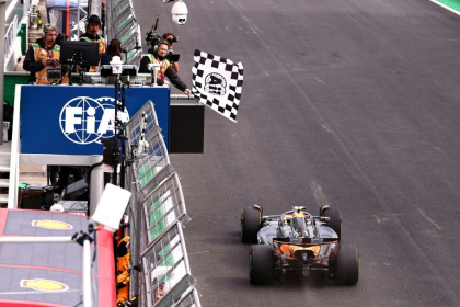 Lando Norris takes the chequered flag at Interlagos to move 24 points clear in the driver's title battle - JEAN CARNIEL (AFP)