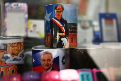Mugs with images of Kast and late Chilean dictator Augusto Pinochet at a shop in the capital, Santiago - RODRIGO ARANGUA (AFP)