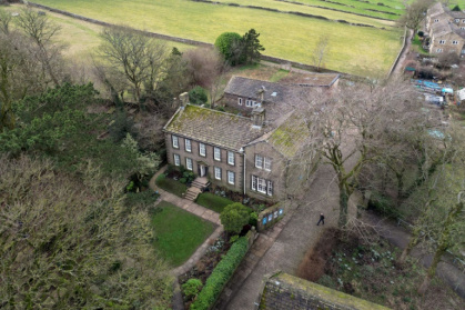 The parsonage where the Brontes lived stands between the village of Haworth and the moors - Oli SCARFF (AFP)