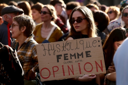 'Hysterical: woman with an opinion,' read one sign as thousands marched for women's rights Sunday - Alex MARTIN (AFP)