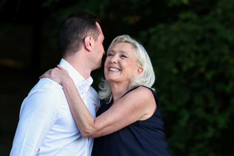 France's Le Pen says still running for president