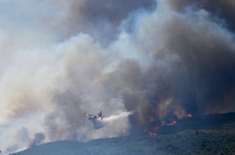 Thousands flee raging wildfires in southern Europe