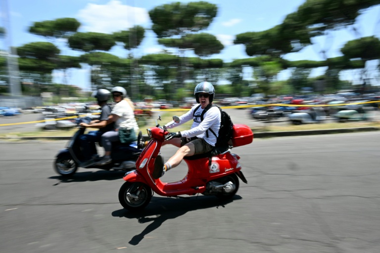 Thousands ride through Rome as Vespa celebrates 80 years