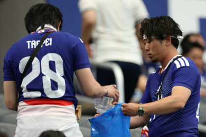 Japan fans tidied up after themselves after their team's opening World Cup game against the Netherlands in Texas - Charlotte Wilson (AFP)