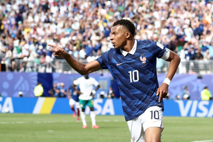 Kylian Mbappe celebrates after scoring France's opening goal against Senegal at the World Cup on Tuesday - CHARLY TRIBALLEAU (AFP)