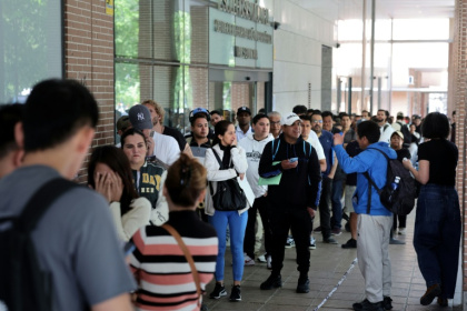 Men, women and children have queued in the streets to obtain documents - Thomas COEX (AFP)
