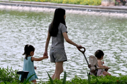 One year after lifting its longstanding two-child limit, Vietnam is extending maternity leave and offering financial help for people to have more babies - Nhac NGUYEN (AFP)