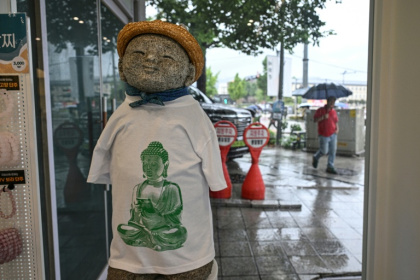 A Buddhism-themed T-shirt displayed at a souvenir store in Seoul - Jade GAO (AFP)