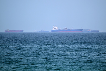 Vessels are pictured off the coast of the Khor Fakkan Container Terminal, a major UAE container port near Oman, in the same region where three tankers were struck - - (AFP)