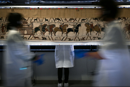 The Bayeux Tapestry depicts the last successful military invasion of England in 1066 - LOU BENOIST (AFP)