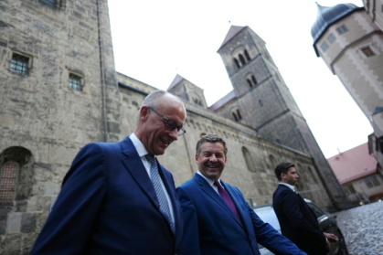 Chancellor Friedrich Merz and his party's Saxony-Anhalt state premier Sven Schulze - Kay Nietfeld (AFP)